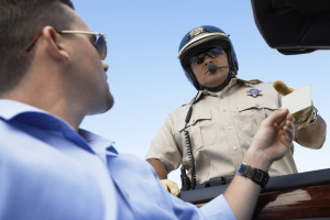 Handing driver license to officer