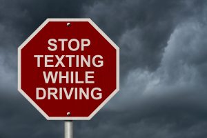 Stop-texting-while-driving-300x200