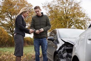 Drivers-exchanging-info-after-accident-300x200